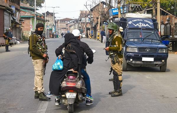 r  Srinagar: Security personnel ask a scooterist to divert his route during restrictions in parts of Downtown in Srinagar, Friday, Nov. 1, 2019. The normal life remained effected on 89th consecutive day since 5th August due to restrictions and shutdown, after the abrogation of Article 370 and bifurcation of the Jammu and Kashmir state into two union territories. (PTI Photo)