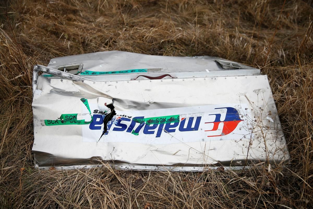 A part of the wreckage of the downed Malaysia Airlines Flight MH17 is seen at its crash site near the village of Grabovo, Donetsk region. Reuters/File