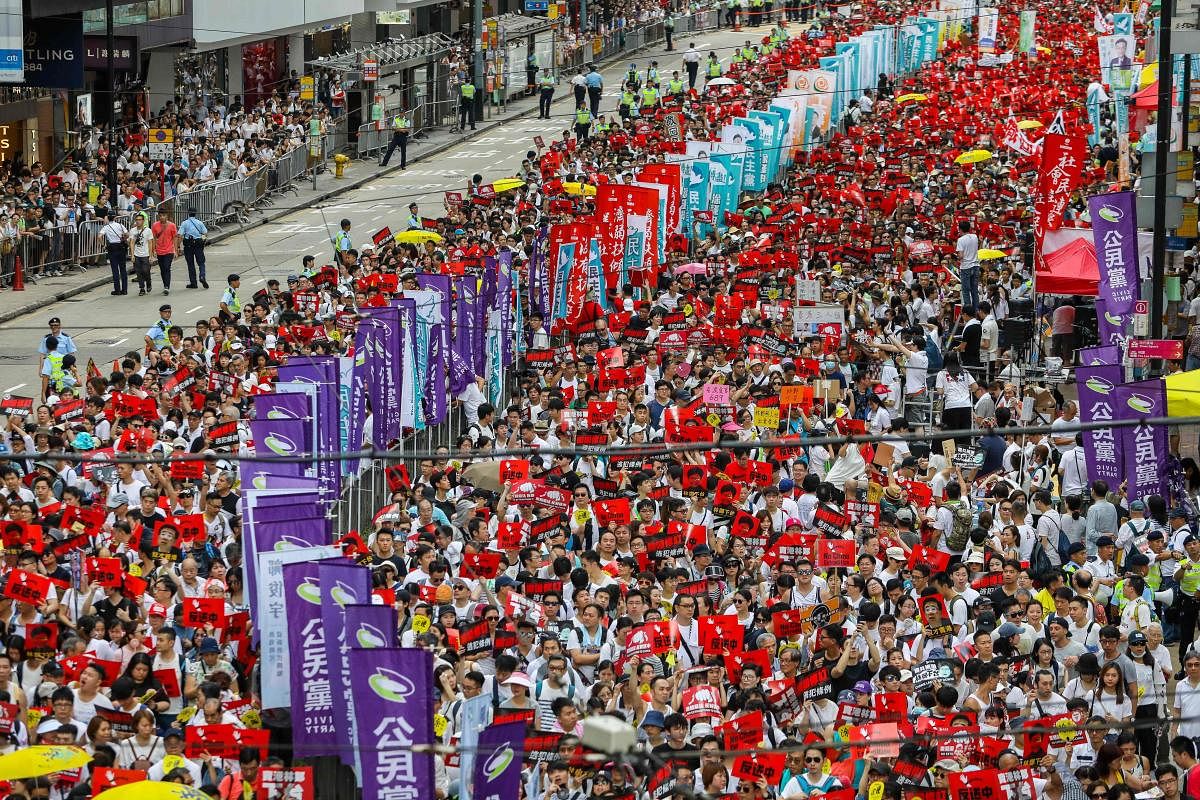  This file picture taken on June 9, 2019 shows protesters marching during a rally against a controversial extradition law proposal in Hong Kong. Credit/AFP Photo