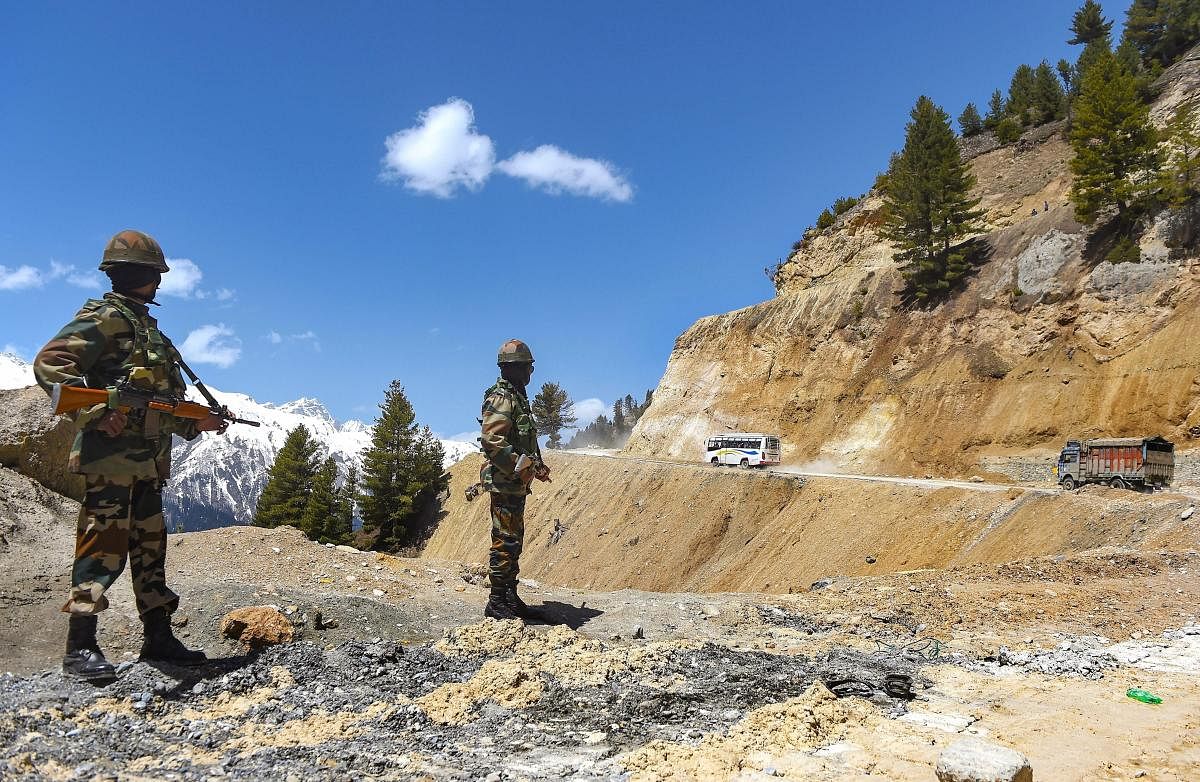 Zojila: Vehicles pass through Zojila Pass, situated at a height of 11,516 feet, on its way to frontier region of Ladakh, Sunday, April 28, 2019. The Srinagar-Leh highway, the only road linking Kashmir with Ladakh, was reopened for traffic after remaining