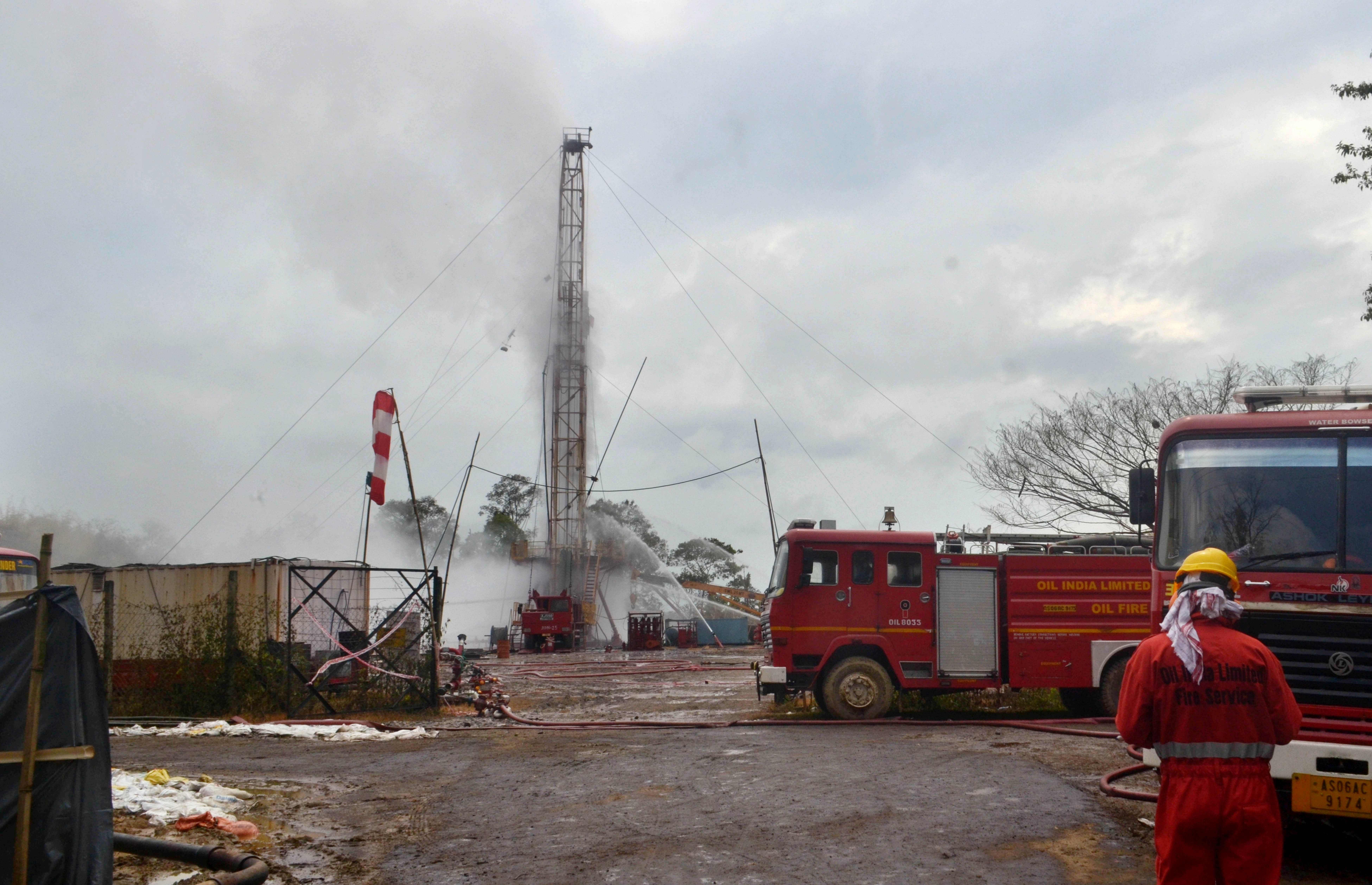 An Oil India Limited (OIL) firefighter oversees works near an oil well site following the May 27 blast at the Baghjan oil field of Tinsukia district, some 550 Kms from Guwahati, the capital of India's northeastern state of Assam on June 1, 2020. (Photo by AFP)