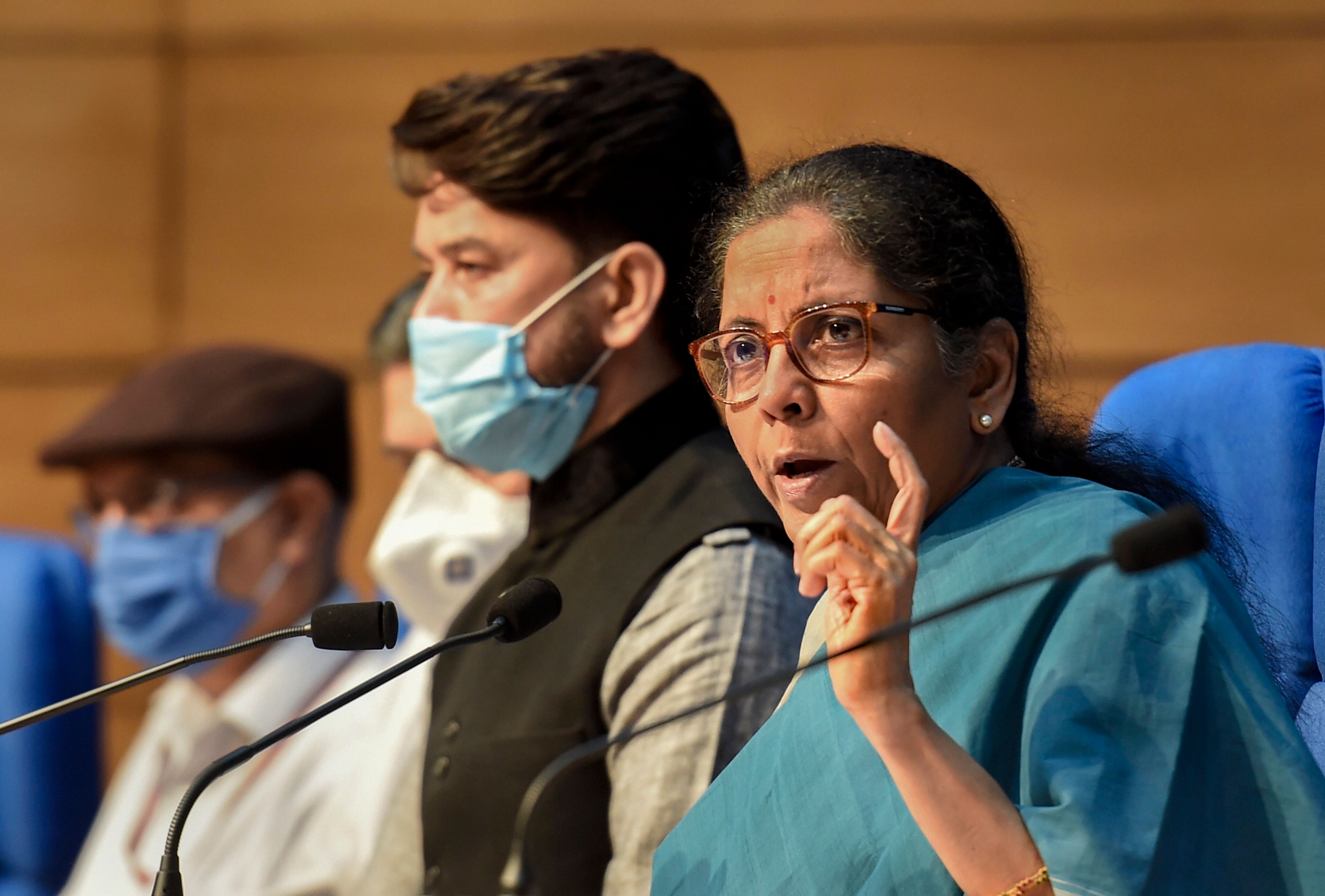 Union Finance Minister Nirmala Sitharaman along with Minister of State Anurag Thakur and officials (PTI Photo)