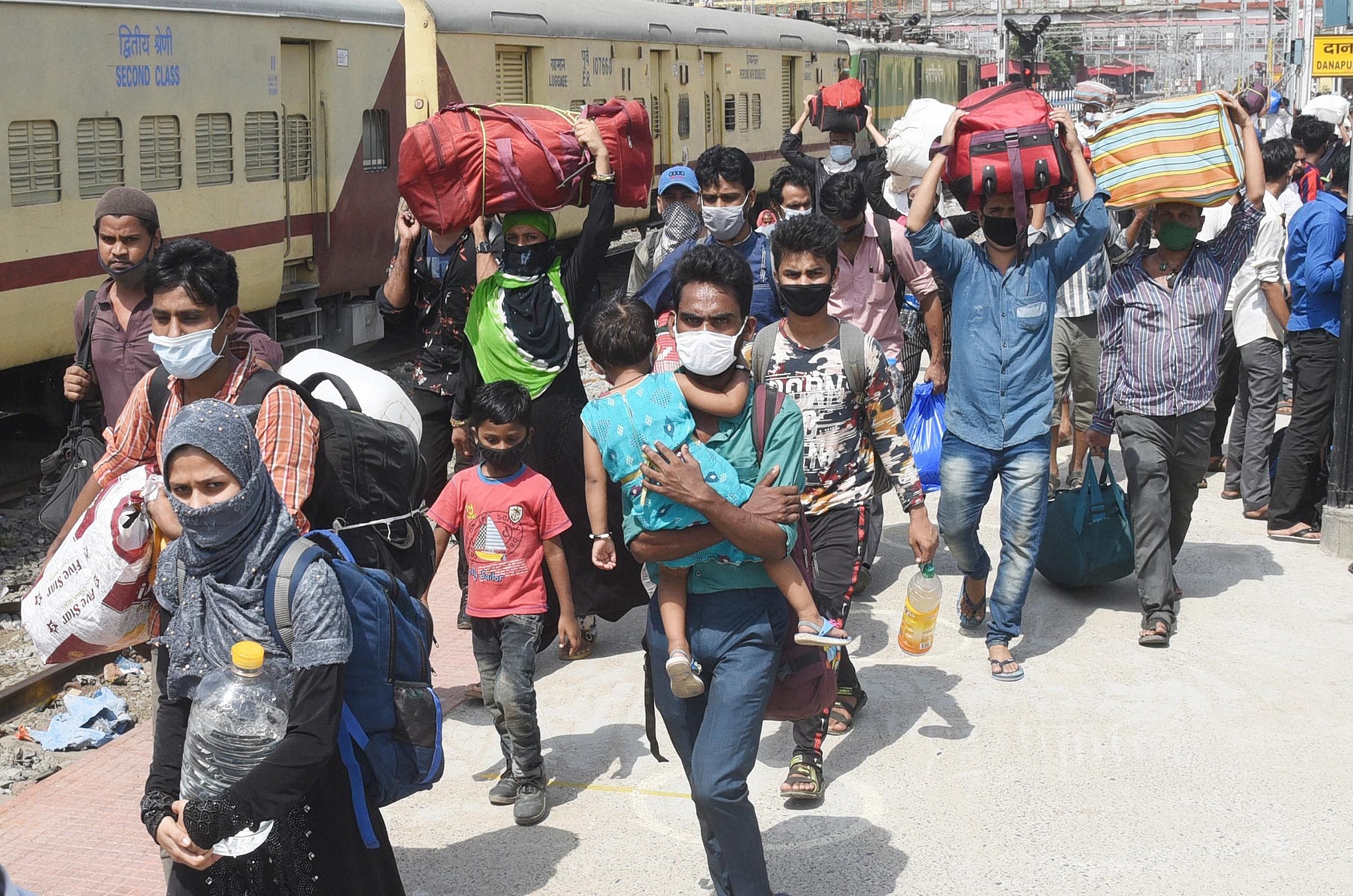 Migrants from Mumbai arrive at Danapur railway station to board a local passenger train to reach their destination, during the ongoing COVID-19 nationwide lockdown, in Maharashtra. (PTI Photo)