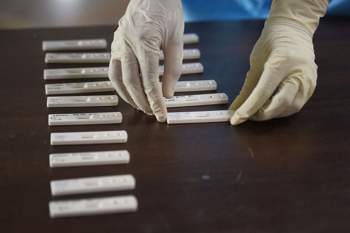 Medics arrange samples of a new fast test (Rapid test) for coronavirus at Rajiv Gandhi Government General Hospital, in Chennai. (PTI Photo)