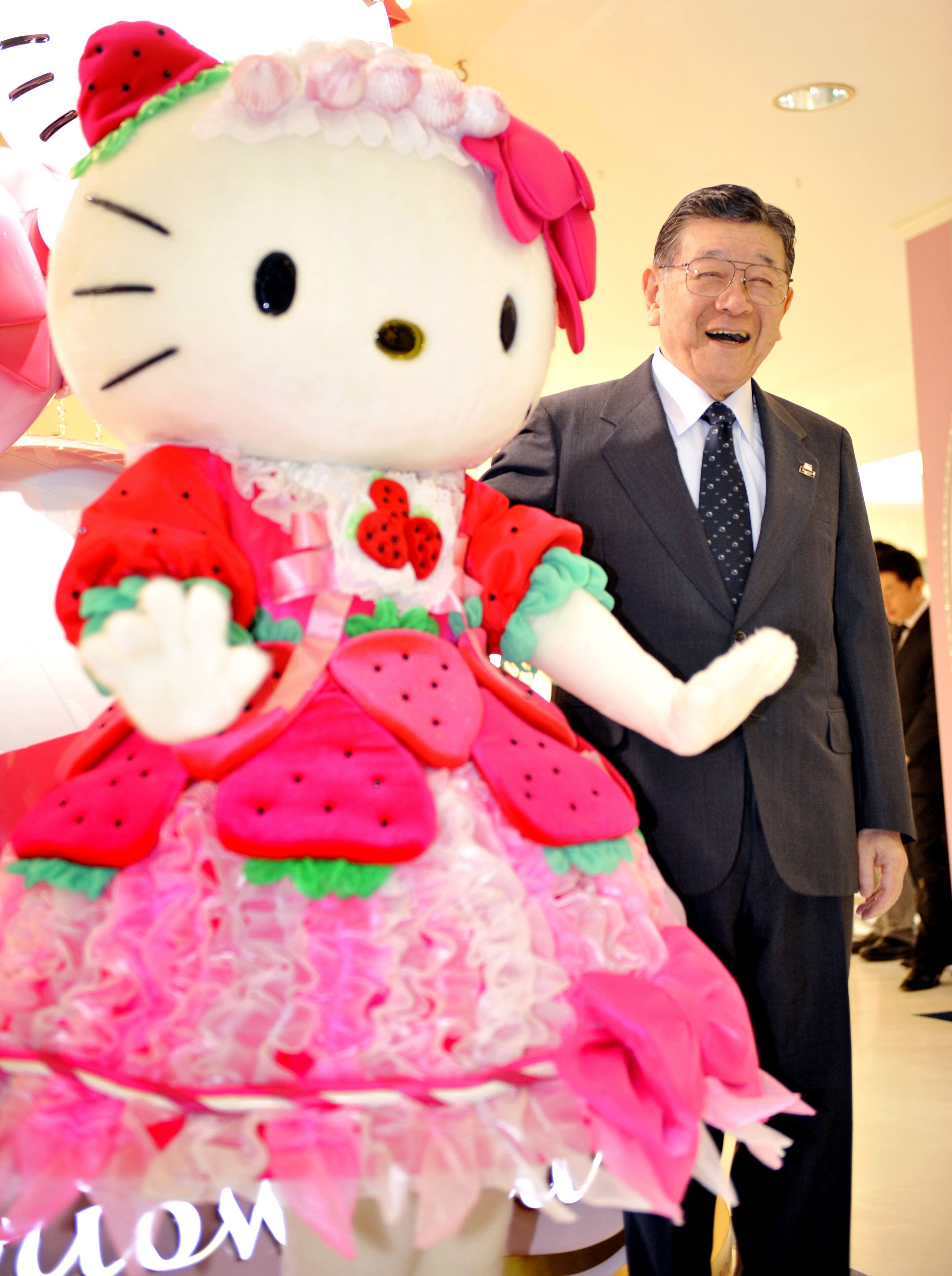 In this file photo taken on October 29, 2009 president of Japanese character business giant Sanrio, Shintaro Tsuji (R), smiles as he poses with character Hello Kitty (L) as the company opens the world's largest Sanrio shop in Tokyo. Credit: AFP