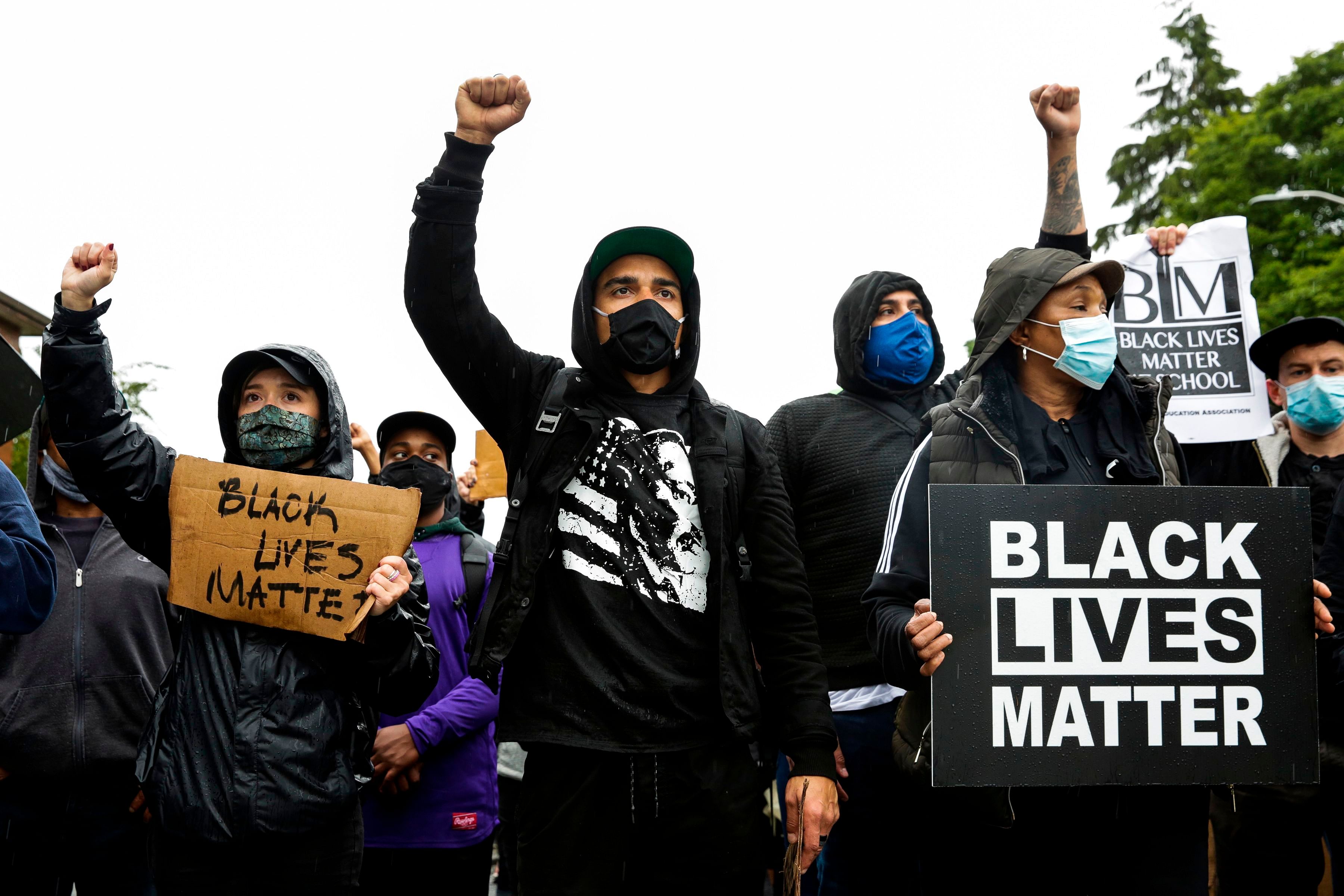 People take part in a "March of Silence" from Judkins Park to Jefferson Park and a statewide general strike in support of all Black lives in Seattle. Credit: AFP Photo