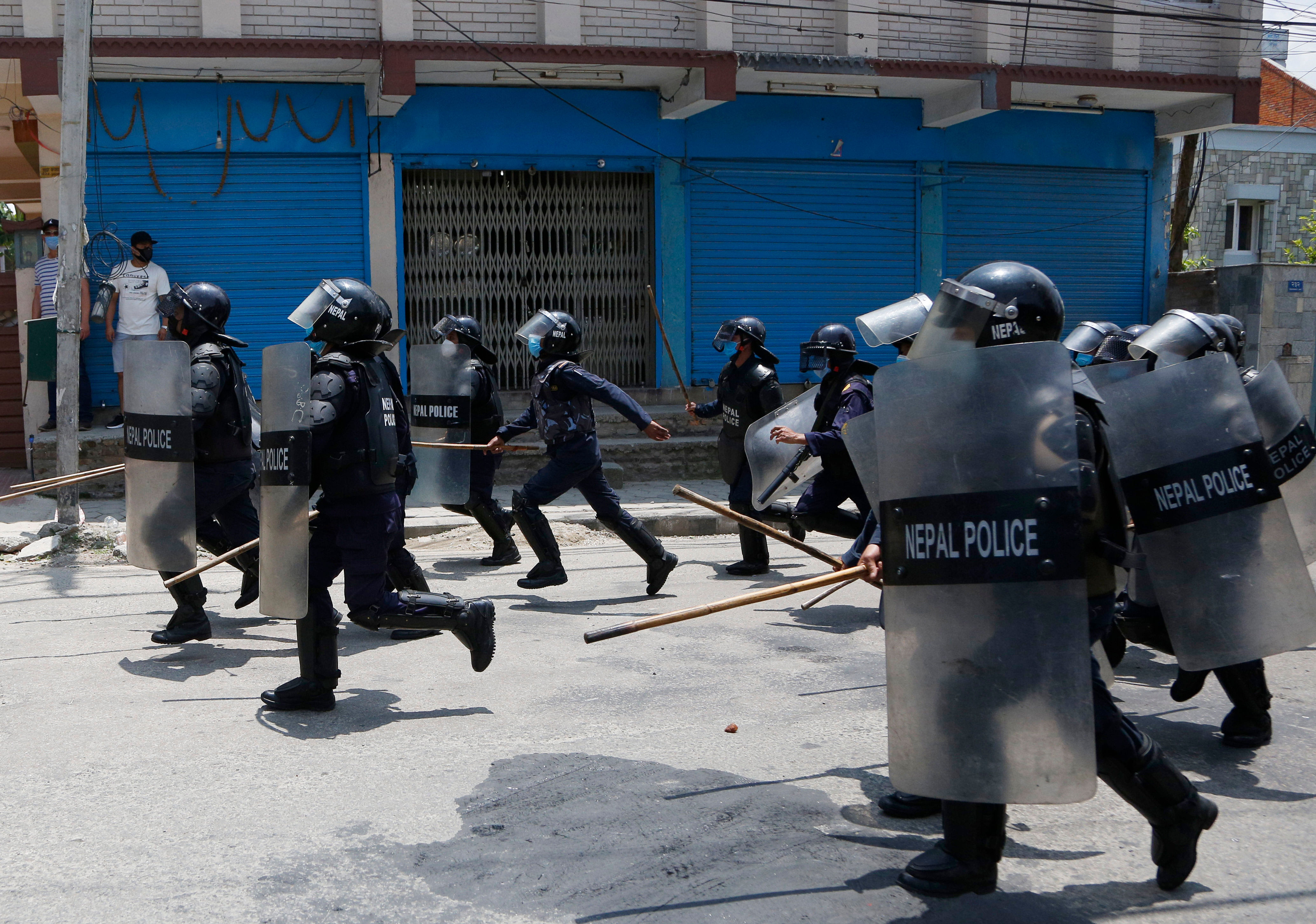 Nepalese police disperse youth who gathered for a protest near prime minister's residence demanding better handling of the COVID-19 pandemic in Kathmandu, Nepal, Thursday, June 11, 2020. About 1000 protesters had gathered demanding increased testing and alleging corruption by government officials while purchasing equipment and testing kits. Credit: AP/PTI Photo