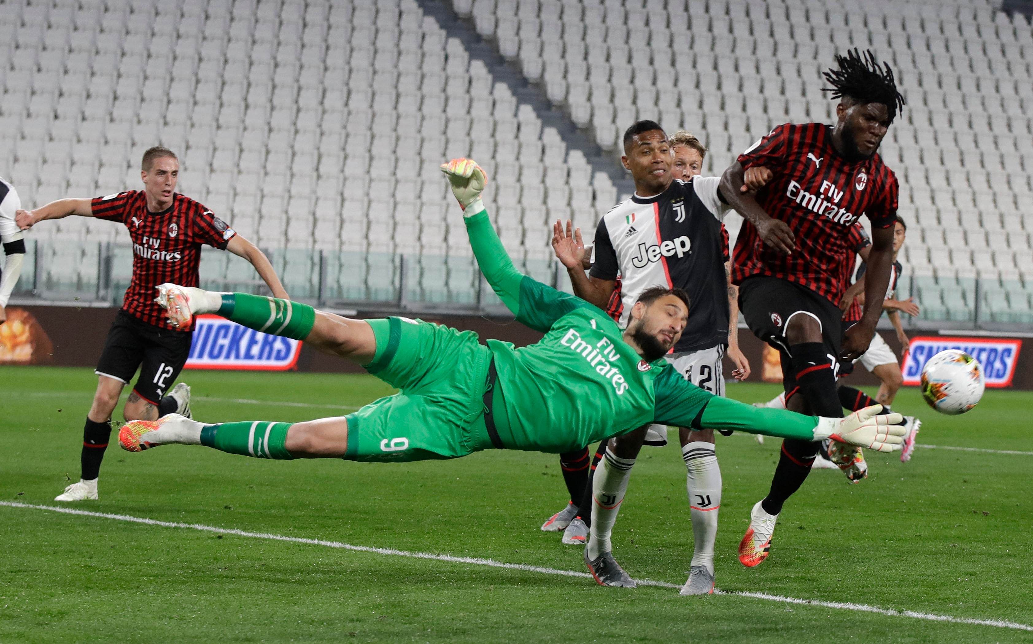  AC Milan's goalkeeper Gianluigi Donnarumma makes a save during an Italian Cup second leg soccer match between Juventus and AC Milan at the Allianz stadium, in Turin, Italy. Credit: AP