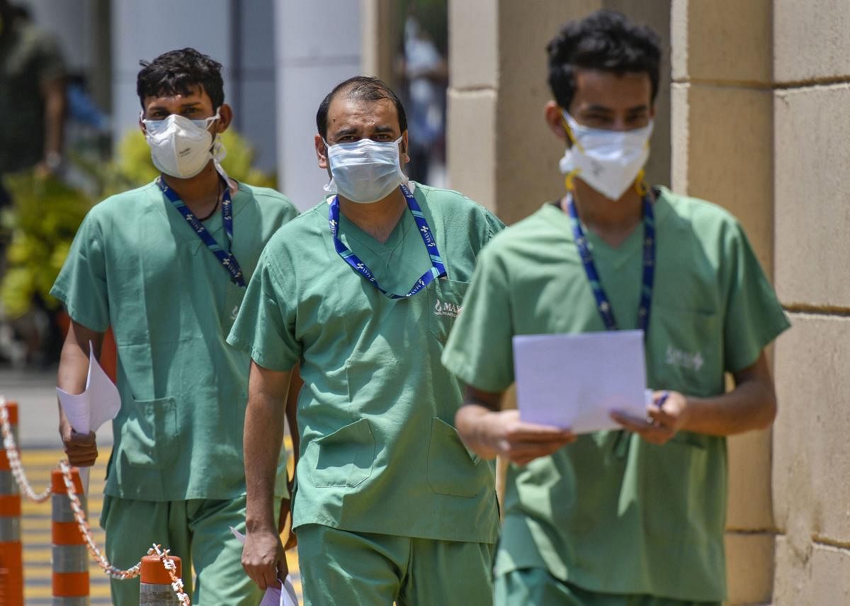  Health workers seen inside the premises of Max Hospital, during the nationwide lockdown to curb the spread of coronavirus, in New Delhi. Credit: PTI