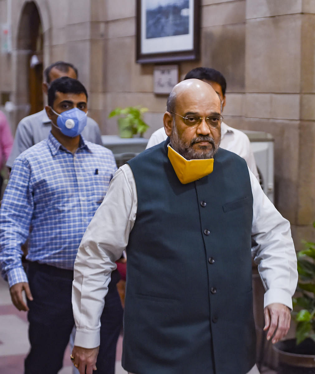 Union Home Minister Amit Shah arrives to hold a meeting to discuss the COVID-19 situation in Delhi, at North Block in New Delhi, Sunday, June 14, 2020. (PTI)