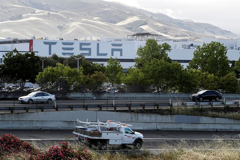 Motorists drive past Tesla's primary vehicle factory. Credits: Reuters Photo
