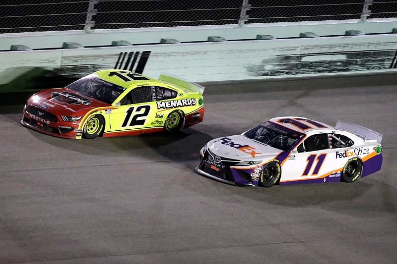 Homestead, Florida, USA; Driver Ryan Blaney (12) and driver Denny Hamlin (11) battle for the lead during the NASCAR Cup series race at Homestead-Miami Speedway. Credits: USA Today Sports