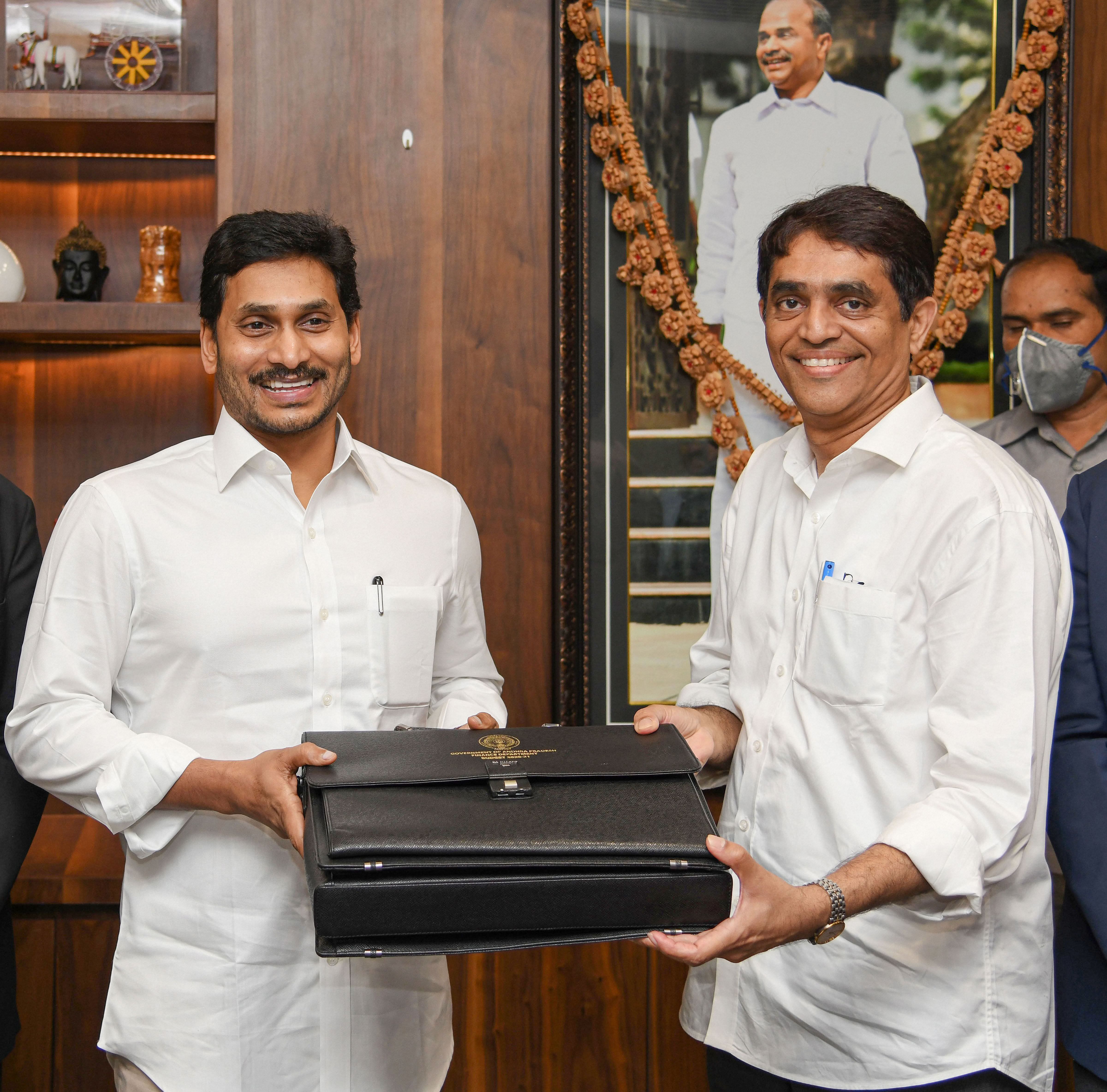 AP Finance Minister Buggana Rajendranath (R) presents a copy of the 2020-2021 State Budget to Chief Minister YS Jaganmohan Reddy at AP Secretariat, Velagapudi in Guntur district, Tuesday, June 16, 2020. (PTI Photo)