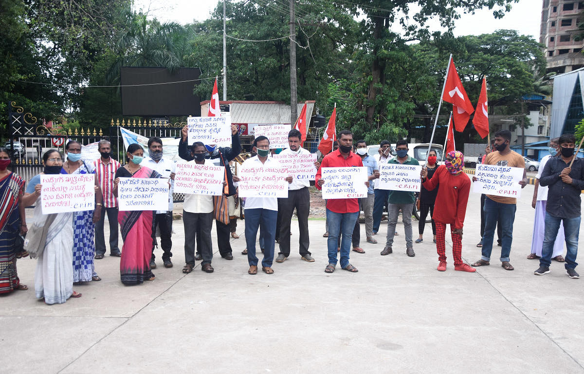 CPM members stage a protest in front of the DC’s office in Mangaluru on Tuesday.