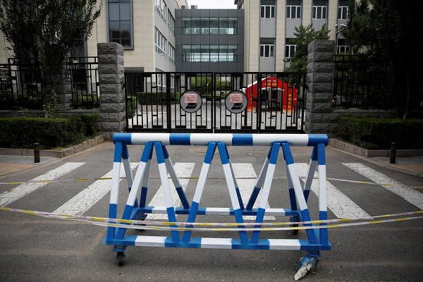 A blocked entrance of a high school is seen after schools were shut to curb the new outbreak of the coronavirus disease (COVID-19) in Beijing, China June 17, 2020. Credit: Reuters