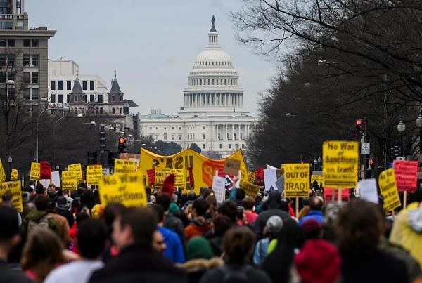 Anti-war activist march from the White House to the Trump International Hotel in Washington, DC, on January 4, 2020. Credit: AFP