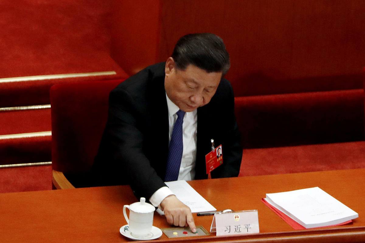 Chinese President Xi Jinping casts his vote on the national security legislation for Hong Kong Special Administrative Region at the closing session of the National People's Congress (NPC) at the Great Hall of the People in Beijing, China May 2