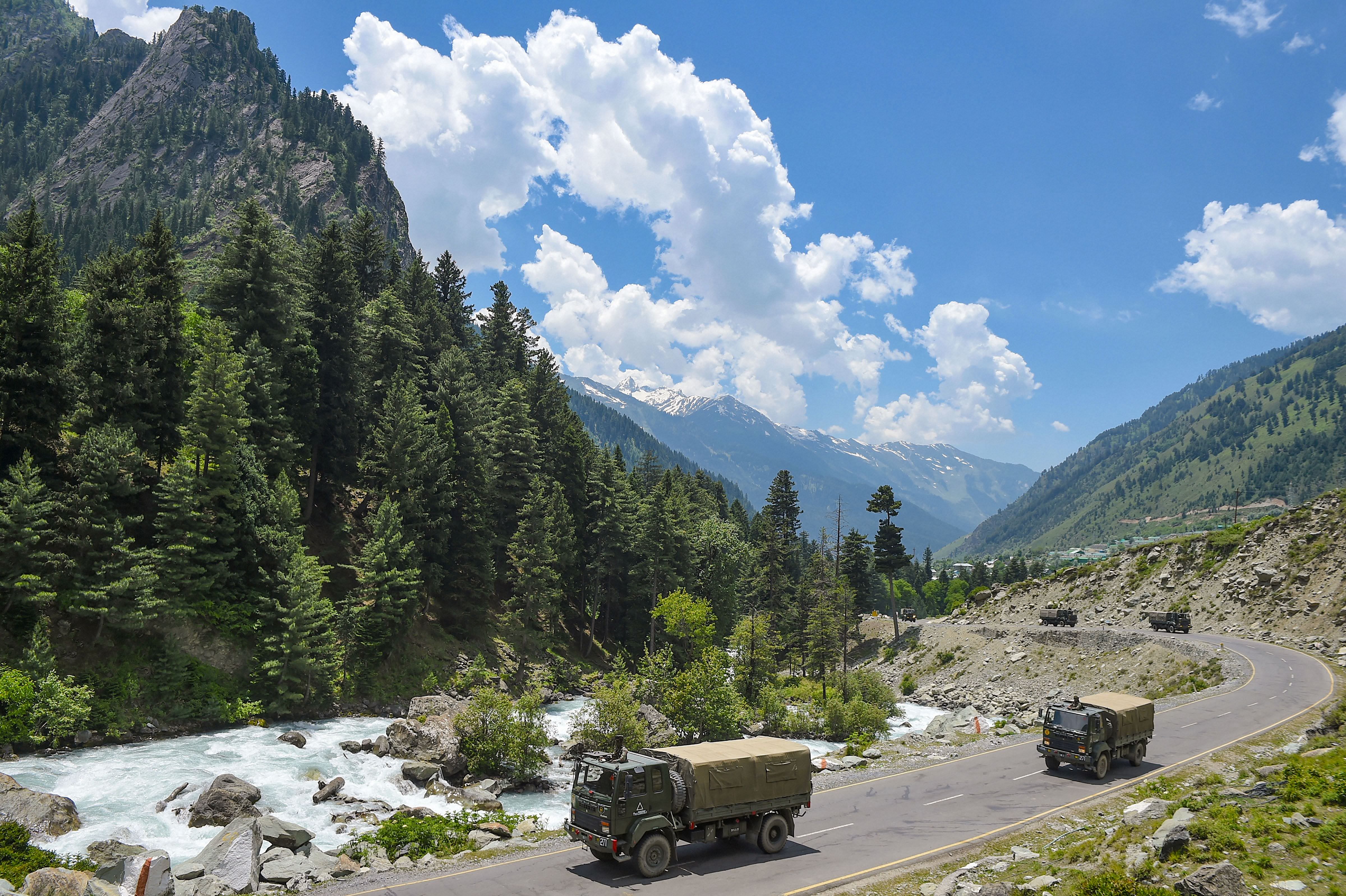 An army convoy moves along the Srinagar-Leh National highway, in Ganderbal district of Central Kashmir, Wednesday, June 17, 2020. Twenty army personnel including a colonel were killed during a clash with Chinese troops in Galwan Valley of the eastern Ladakh region on Monday night. (PTI Photo)