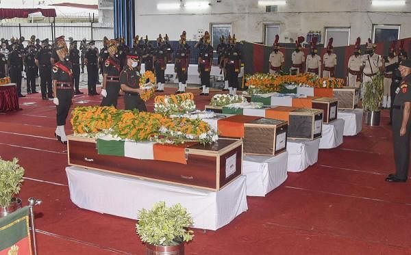 Army personnel pay tribute to the mortal remains of Bihar regimental jawans, who were killed during the face-off between Indian and Chinese troops in Ladakh's Galwan Valley, at Jaiprakash Narayan Airport in Patna, Thursday, June 18, 2020. Credit: PTI Photo