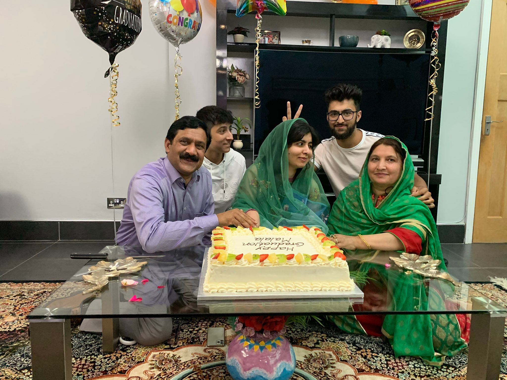 Malala, 22, who attended Oxford's Lady Margaret Hall college, took to Twitter to share two pictures that show her celebrating the milestone with her family. Credit/Twitter (Malala)