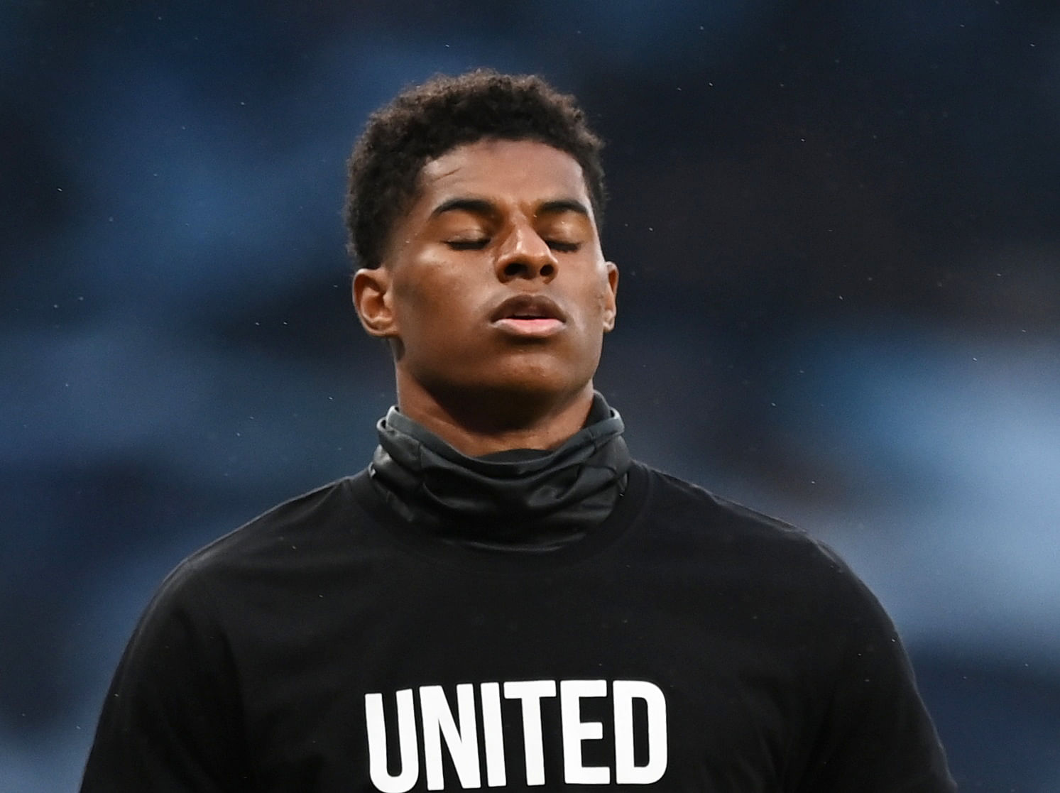 Manchester United's Marcus Rashford with a message against racism during the warm up before the match, as play resumes behind closed doors following the outbreak of the coronavirus disease (COVID-19). Credits: Reuters Photo