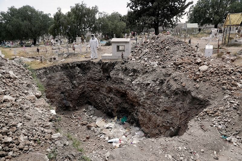 Diana Avila, director of the cemeteries in Ecatepec de Morelos shows the grave where people can be buried, who died of the coronavirus disease. Credits: Reuters Photo