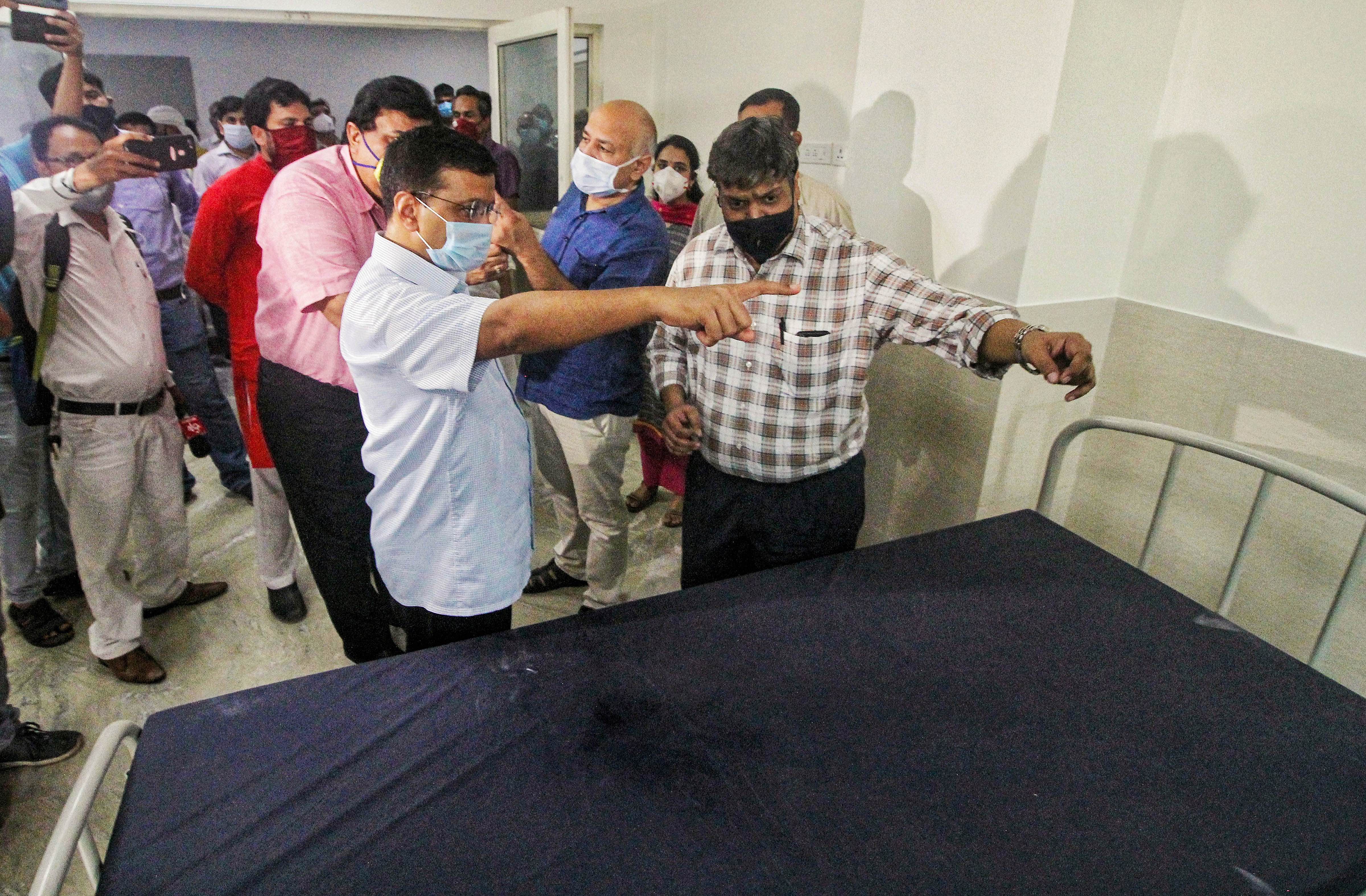 elhi Chief Minister Arvind Kejriwal with Deputy CM Manish Sisodia inspect a hospital with 450 beds which is all set to open at Burari. Credits: PTI Photo