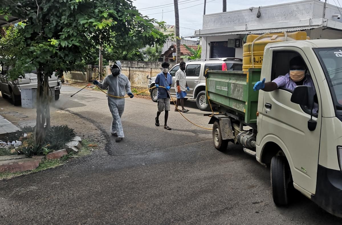 Disinfectants sprayed around a private hospital in Chamarajanagar on Monday. DH PHOTO
