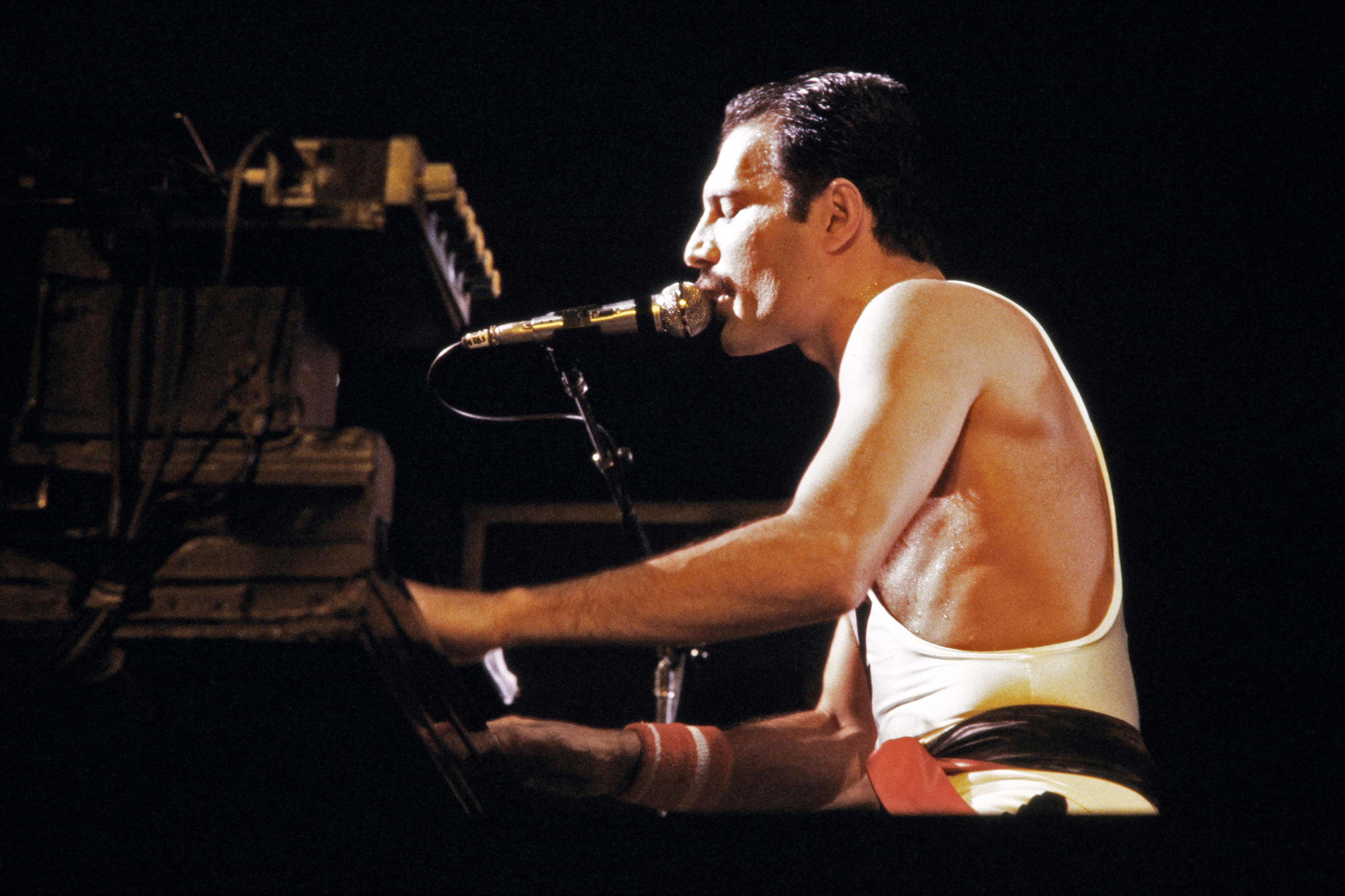 In this file photo taken on September 18, 1984 rock star Freddie Mercury, lead singer of the rock group "Queen", performs during a concert at the Palais Omnisports de Paris Bercy (POPB). (Photo by AFP)