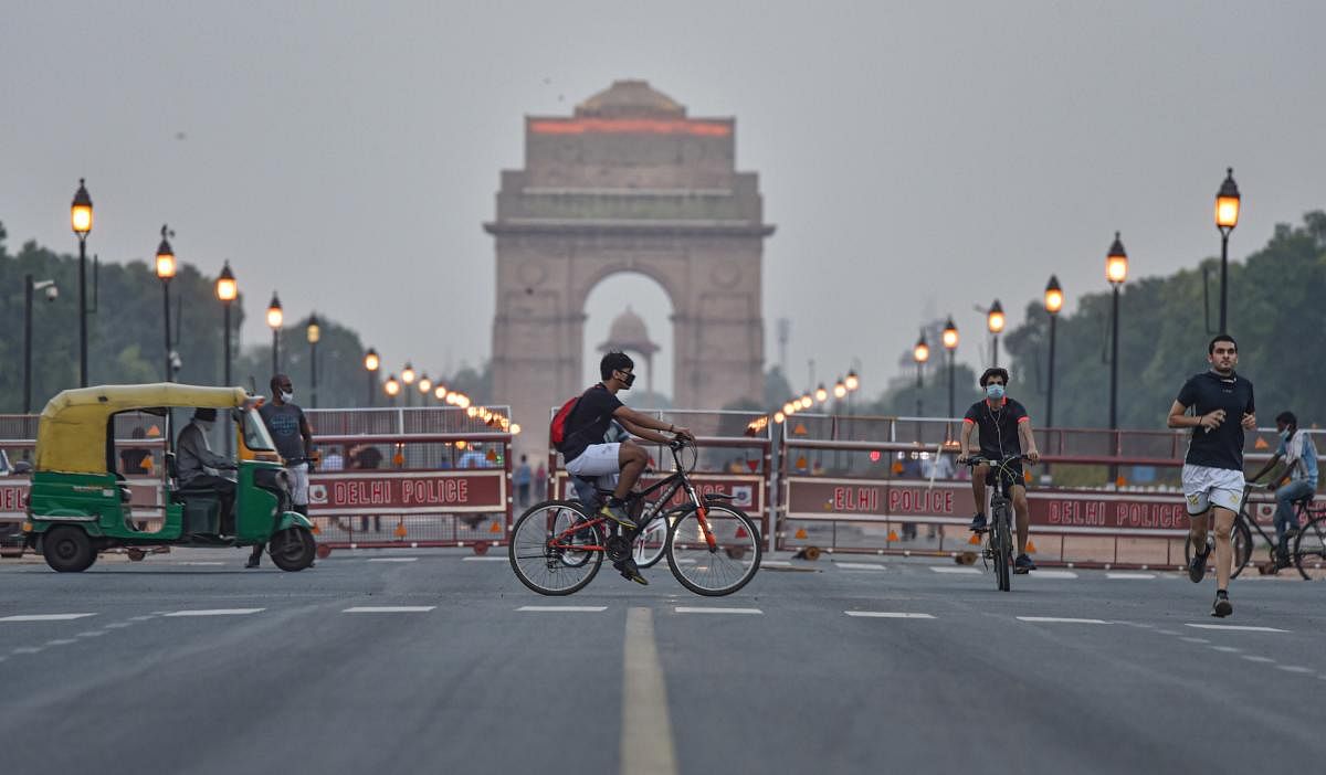 Cyclists near India Gate on a pleasant evening, during the ongoing nationwide lockdown, in New Delhi, Saturday, June 13, 2020. Credit/PTI Photo