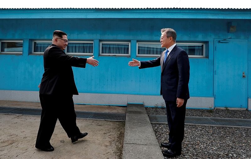South Korean President Moon Jae-in and North Korean leader Kim Jong Un shake hands at the truce village of Panmunjom inside the demilitarized zone separating the two Koreas, South Korea. Credits: Reuters Photo