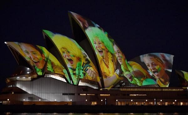 Sydney Opera House is lit in celebration of Australia and New Zealand’s joint bid to host the FIFA Women’s World Cup 2023, in Sydney on June 25, 2020. Credit: AFP