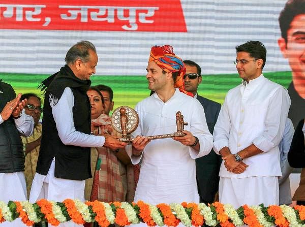 Congress President Rahul Gandhi is being presented a memento by Rajasthan Chief Minister Ashok Ghelot and Deputy Chief Minister Sachin Pilot during the Kisan Rally, in Jaipur, Wednesday, Jan. 09, 2019. (PTI Photo)