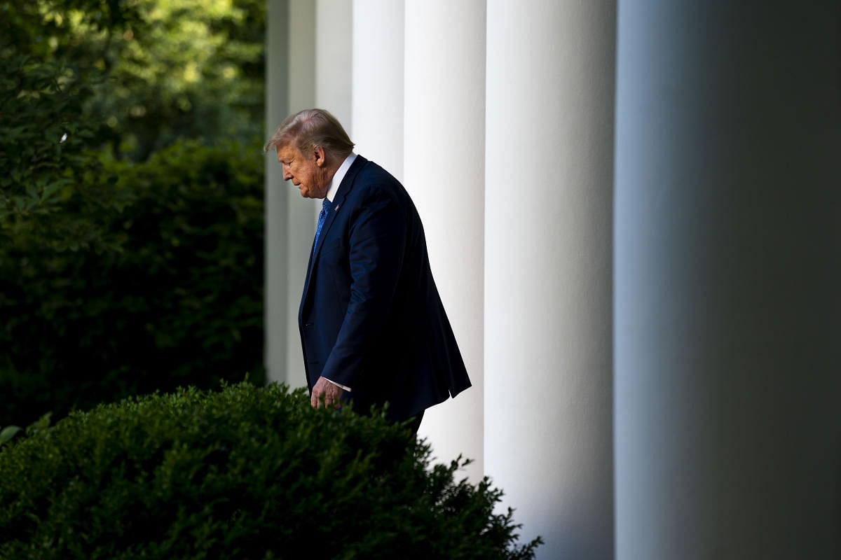 President Donald Trump walks out of the Oval Office to make a statement in the Rose Garden of the White House in Washington.