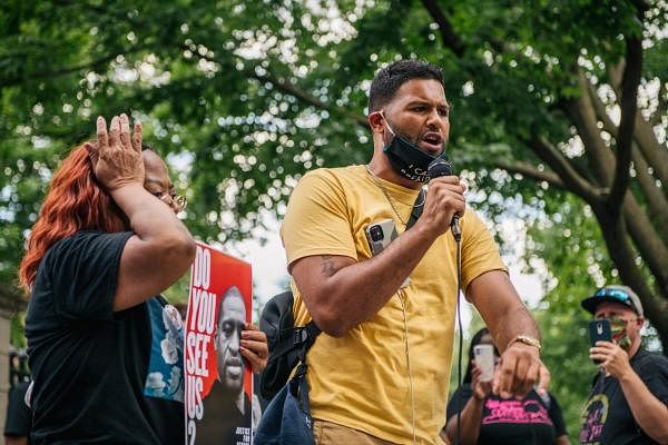 Community Activist Jonathan Mason, 33, speaks to a crowd on June 24, 2020 in St. Paul, Minnesota. Protestors gathered outside of Governor Tim Walzs mansion to demand a stricter reform of police legislation in the state of Minnesota. The city of St. Paul continues protests and gatherings to honor the death of George Floyd and other Black men and women who have been killed by officers of the Minnesota Police Department. Credit: Getty Images/AFP