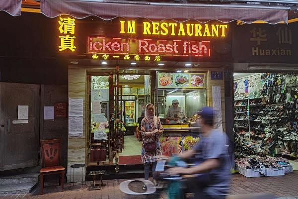 People eat at a halal restaurant in Guangzhou's Xiaobei neighborhood, nicknamed "little Africa", as it starts to recover from a lockdown in April after the outbreak of the coronavirus disease (COVID-19), in Guangdong province, China June 17, 2020. Credit: Reuters Photo