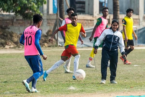 n this photograph taken on February 5, 2020, head coach of Dhaka Football City Club, Mirona (R), reacts as she trains players on a field on the outskirts of Dhaka. Credit: AFP Photo