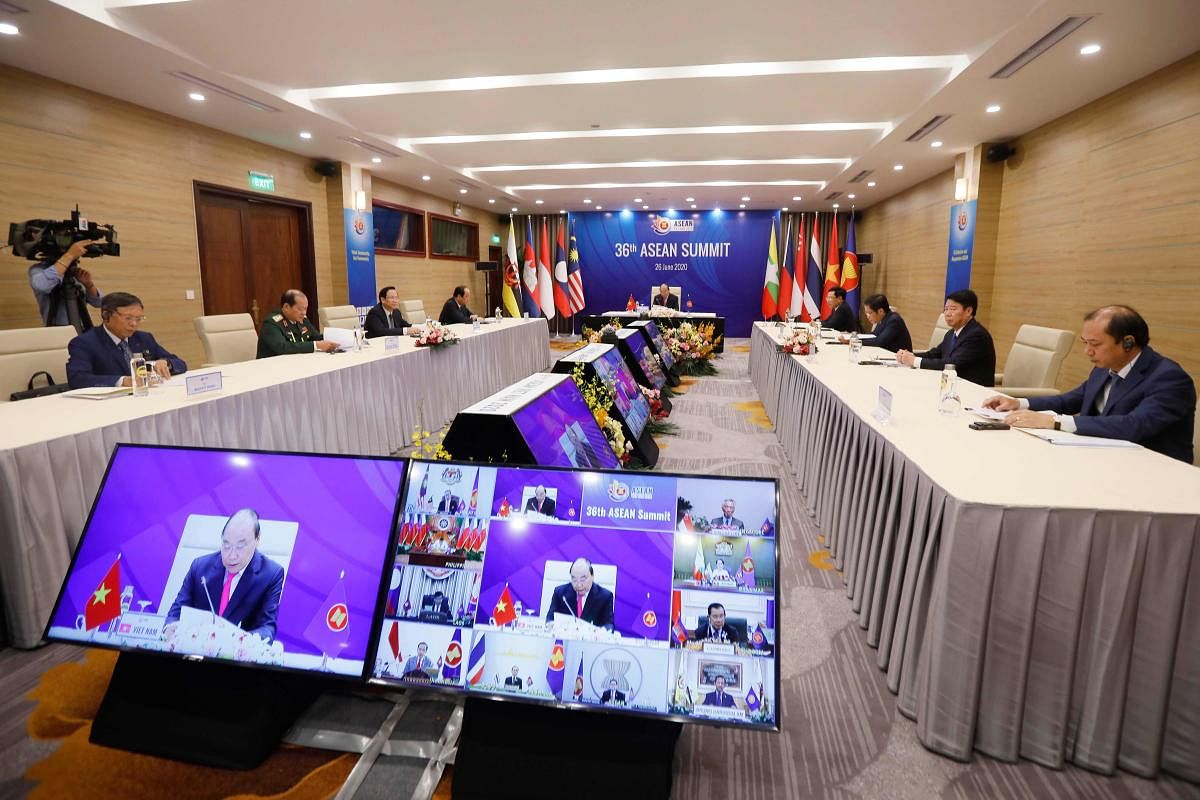 Vietnam's Prime Minister Nguyen Xuan Phuc (C) addresses regional leaders during the Association of Southeast Asian Nations (ASEAN) Summit, held online due to the COVID-19 coronavirus pandemic, in Hanoi on June 26, 2020. Credit/AFP Photo