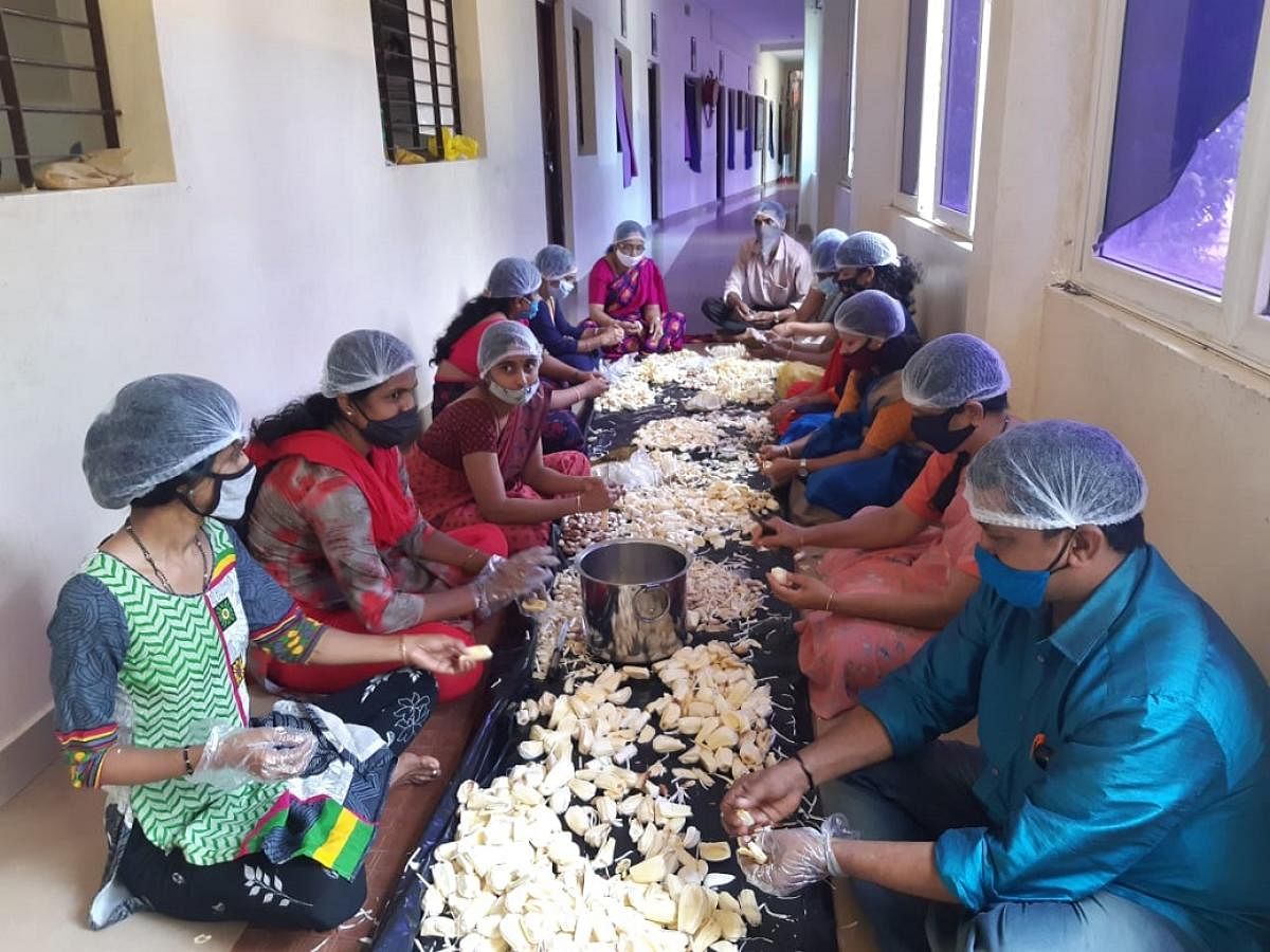 Faculty members of Ambika Group of Institutions in Puttur preparing for jackfruit chips.
