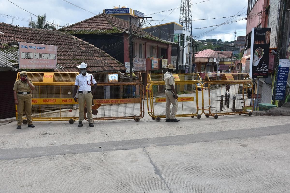 The road leading to Omkareshwara Temple in Madikeri has been sealed down, as a private clinic of a senior physician who tested positive for Covid-19, is situated on the very road. DH Photo
