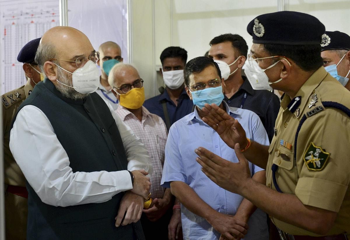 Home Minister Amit Shah with Delhi Chief Minister Arvind Kejriwal visits Sardar Patel COVID Care Centre and Hospital (PTI Photo)