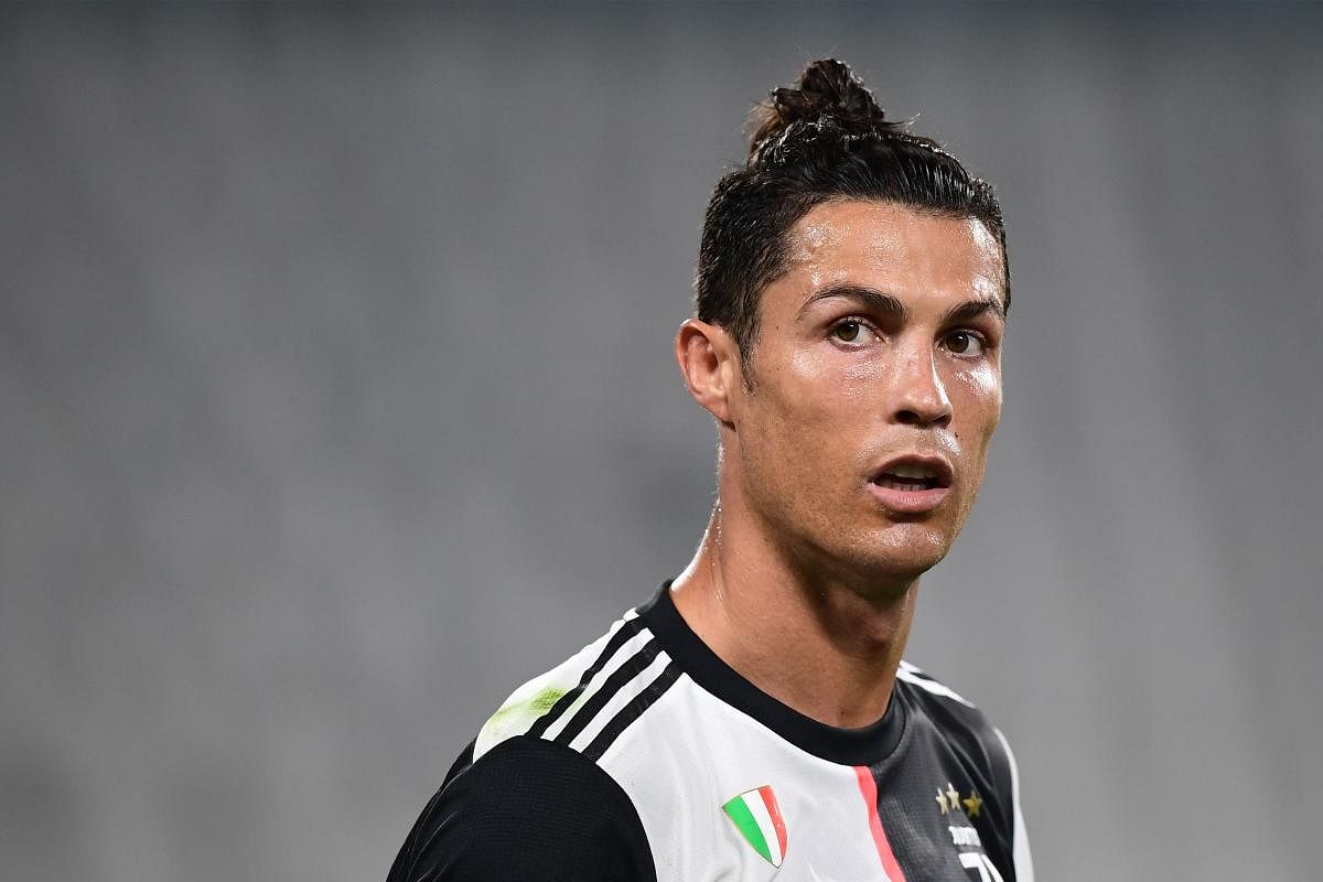 Juventus' Portuguese forward Cristiano Ronaldo reacts during the Italian Serie A football match Juventus vs Lecce played on June 26, 2020 behind closed doors at the Juventus stadium in Turin, as the country eases its lockdown aimed at curbing the spread of the COVID-19 infection, caused by the novel coronavirus. Credit/AFP Photo