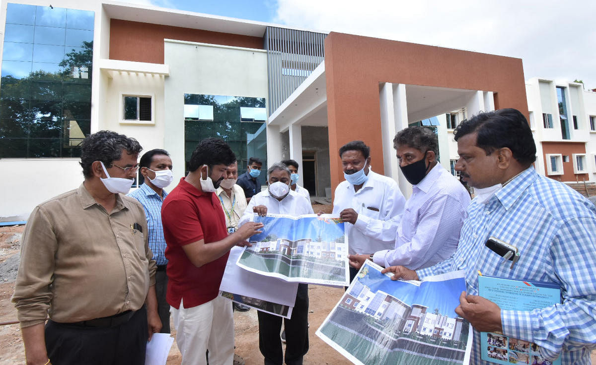 MP Pratap Simha inspects construction work of Mother and Child Hospital in Mysuru on Saturday. DH PHOTO