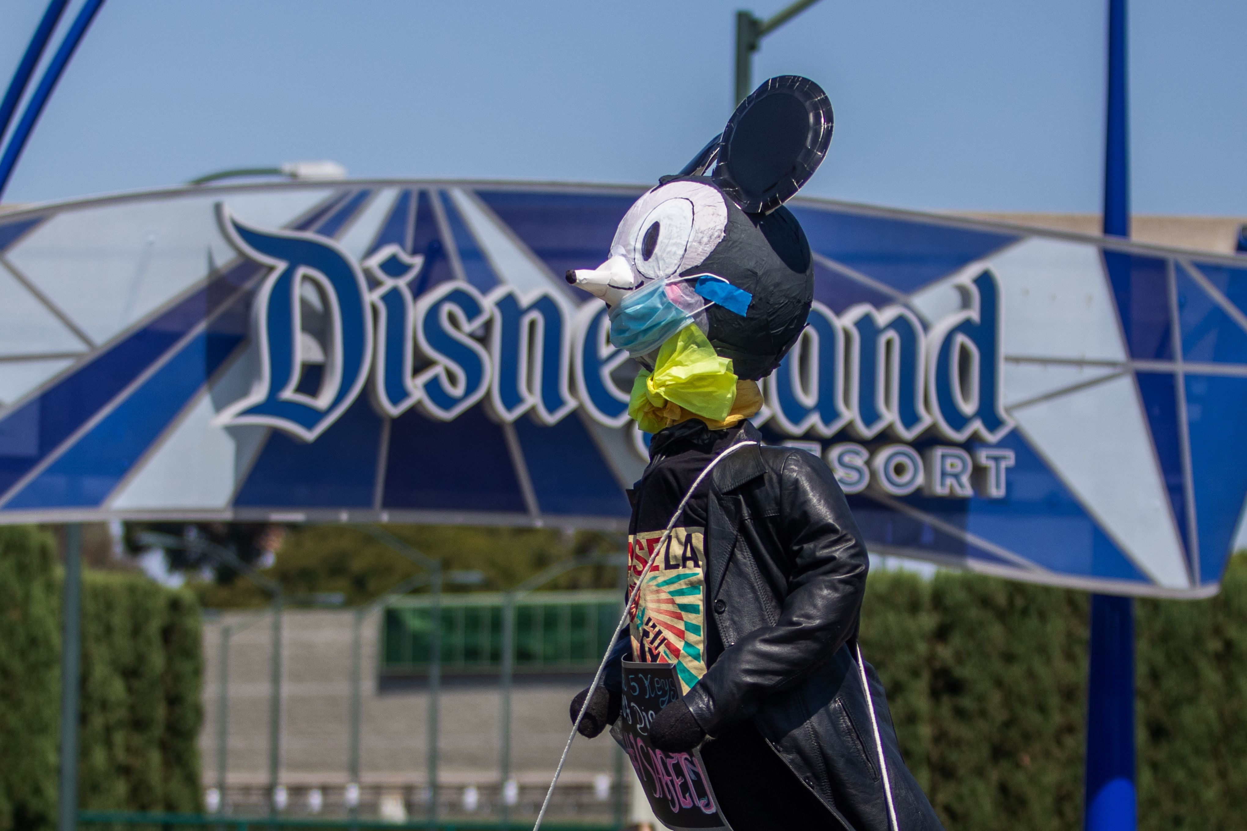 A pair of Disneyland unions are calling upon more than 17,000 cast members to protest the proposed July 17 reopening of Disney’s Anaheim theme parks out of concern for employee safety. (Photo by AFP)