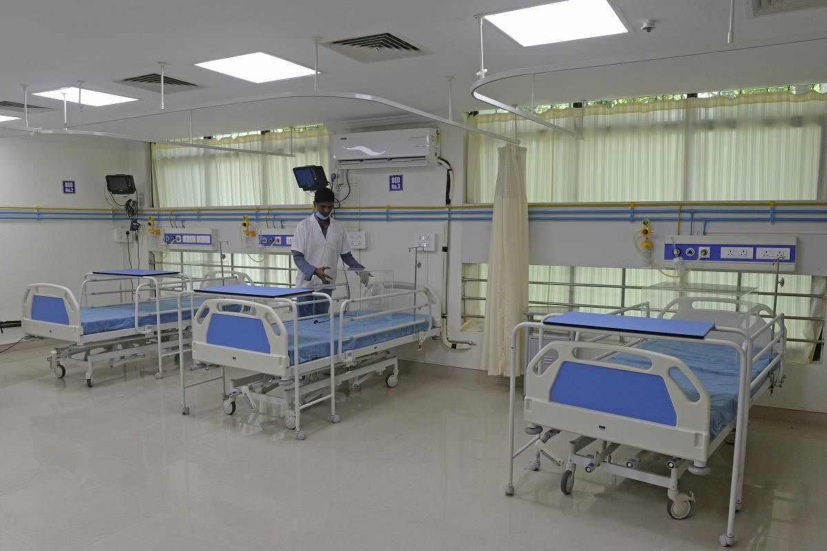 A member of medical staff inspects the intensive care unit (ICU), which is being prepared for the COVID-19 coronavirus patients, at The Telangana Institute of Medical Sciences and Research (TIMS) at Gachibowli in Hyderabad on June 25, 2020. (AFP)