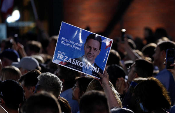 A view shows a placard of Warsaw Mayor Rafal Trzaskowski, presidential candidate of the main opposition Civic Platform (PO) party, after the announcement of the first exit poll results on the first round of presidential elections in Warsaw, Poland, June 28, 2020. Credit: Reuters