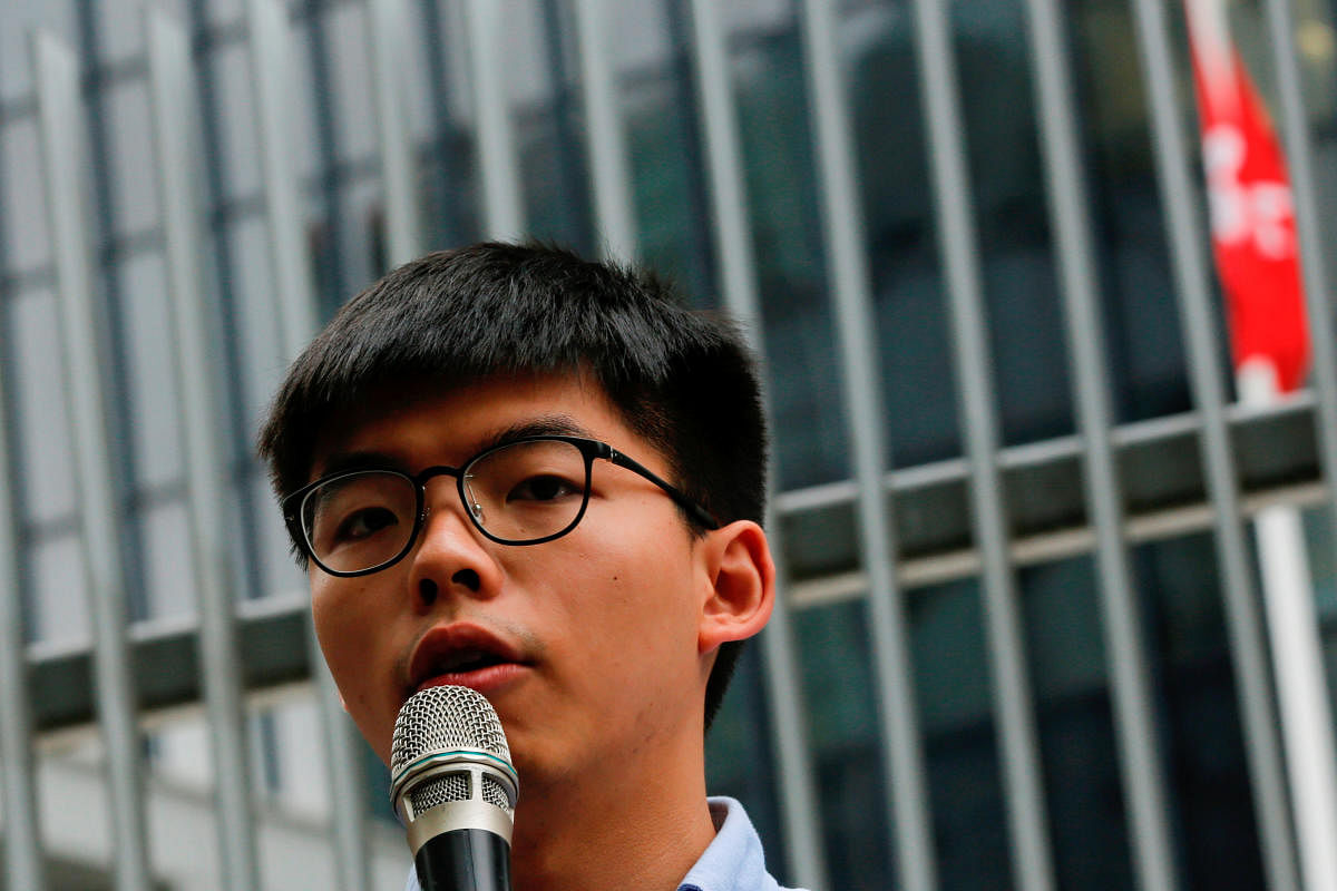 Joshua Wong (in picture), Nathan Law, Jeffrey Ngo and Agnes Chow said they were ending their involvement in Demosisto, a party that has infuriated Beijing by campaigning for universal suffrage and for foreign countries to sanction China for rights abuses. Credit/Reuters File Photo