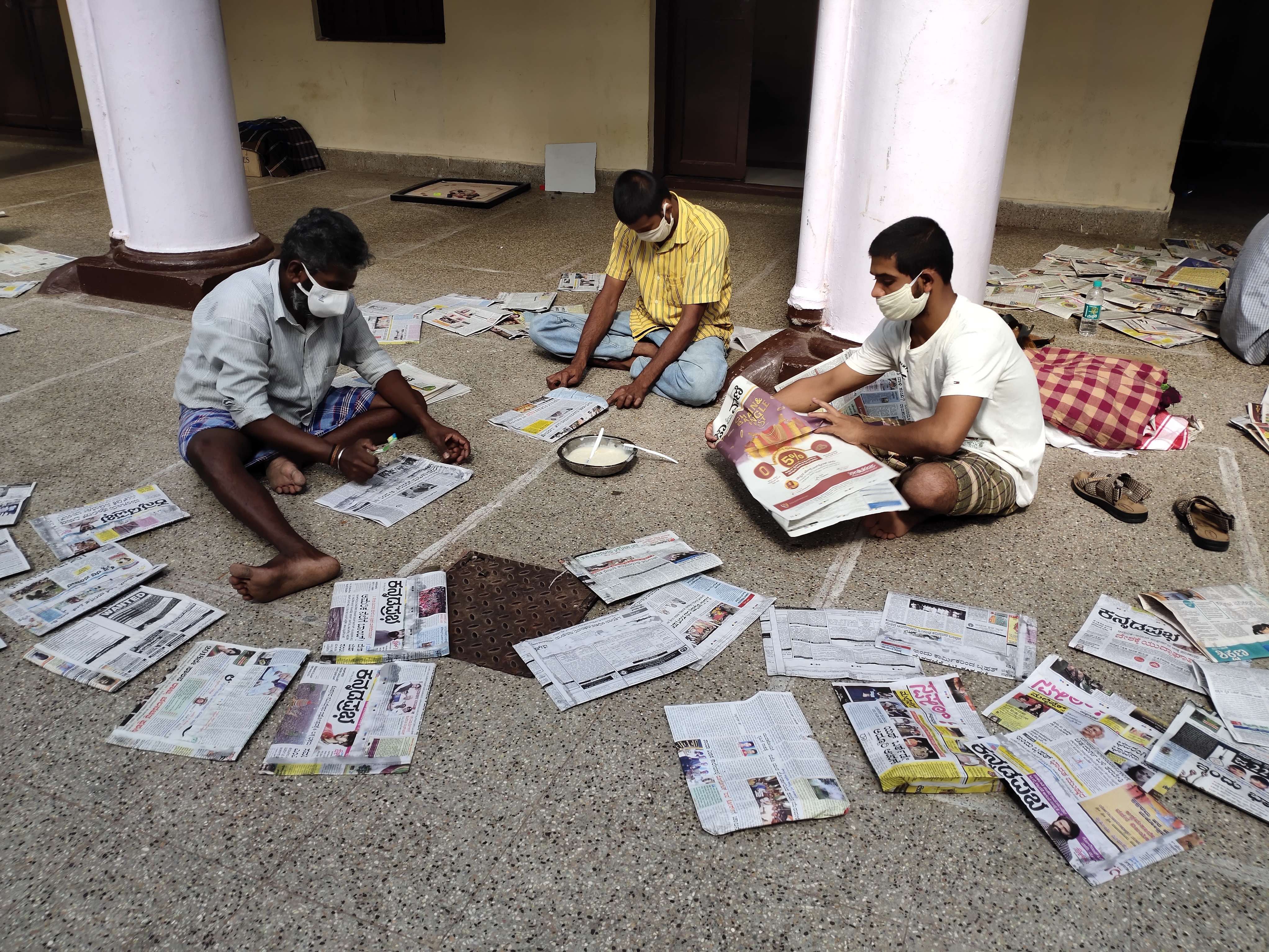 People at rehabilitation centre at Nanjaraja Bahadur Choultry, in Mysuru, recently, engaged in preparation of paper covers. Credit: DH Photo
