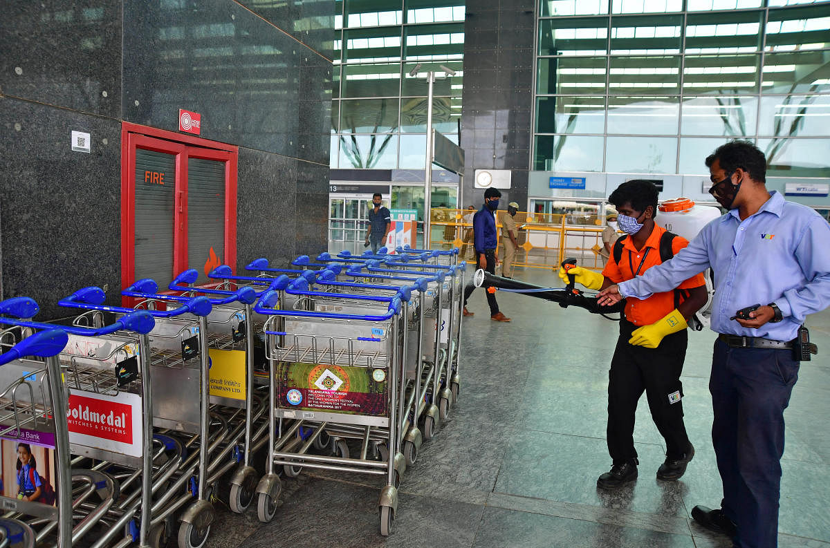 Trolleys being sanitized at Kempegowda International airport, Bengaluru.
