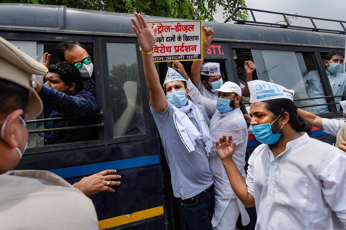  Police detain AAP workers during a protest against hike in fuel price, outside BJP HQ in New Delhi (PTI Photo)